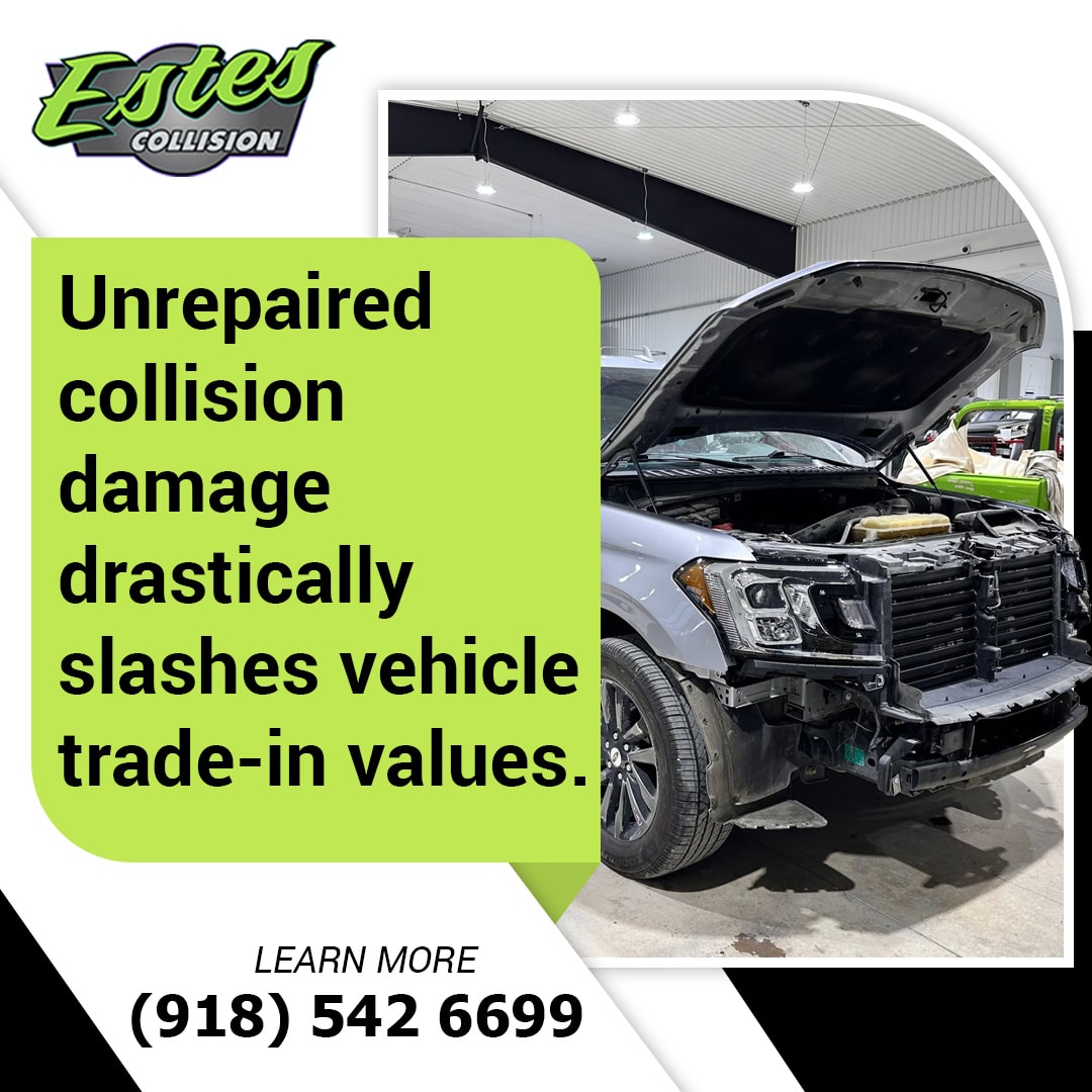A silver SUV with front-end collision damage undergoing repair in an auto body shop, alongside text warning about trade-in value loss.
