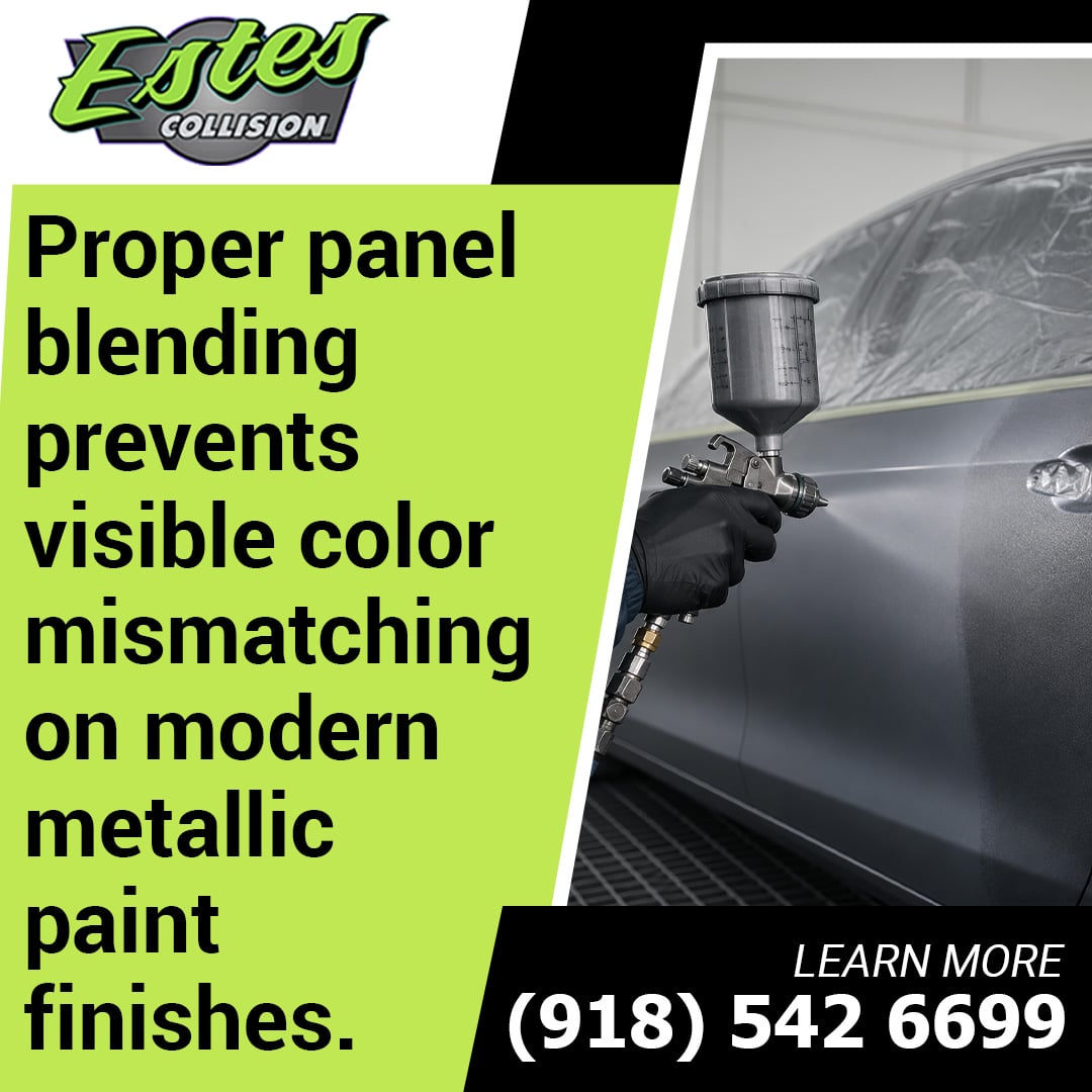 Auto body technician in black protective gloves spraying silver metallic paint onto a car door panel using a spray gun in a paint booth.