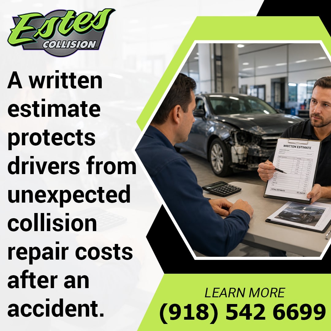Auto body repair specialist showing a written repair estimate on a clipboard to a customer in front of a damaged car in the workshop.