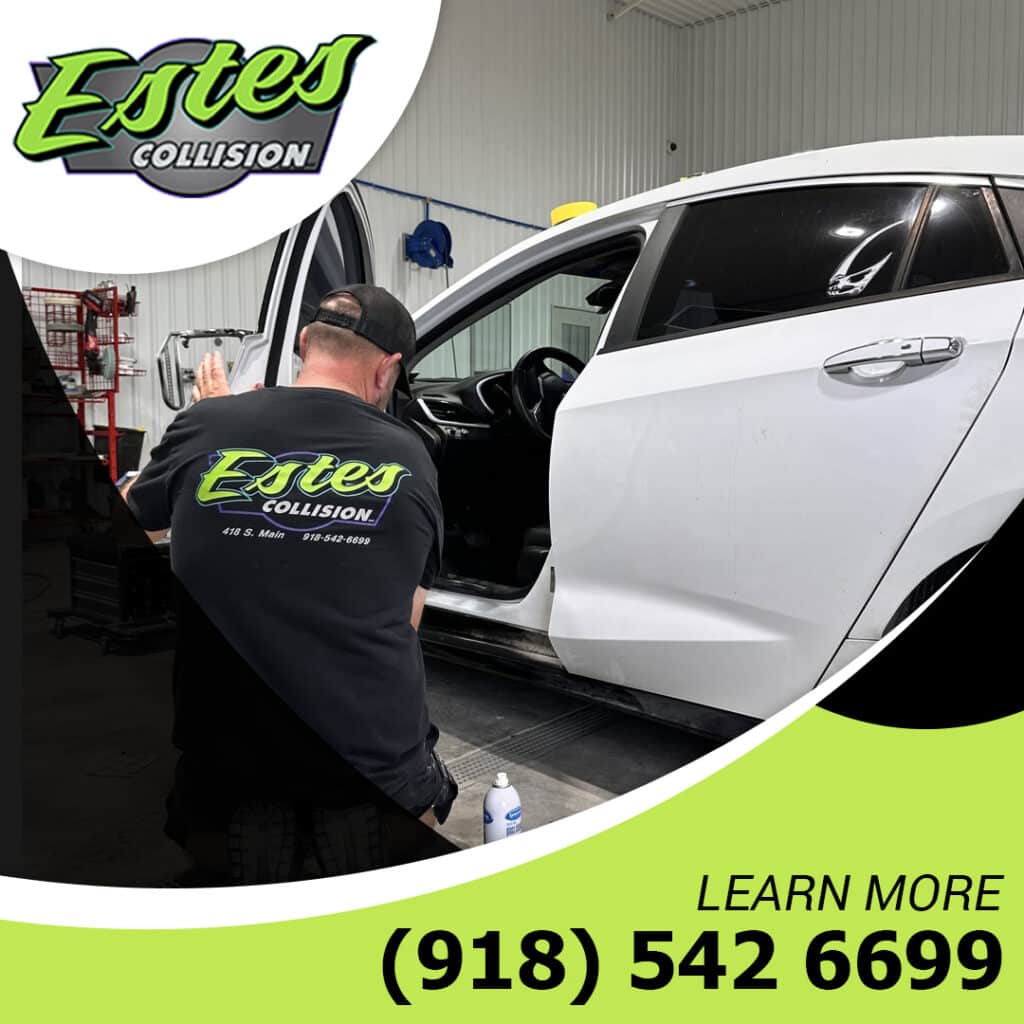 Auto body technician repairing a vehicle.