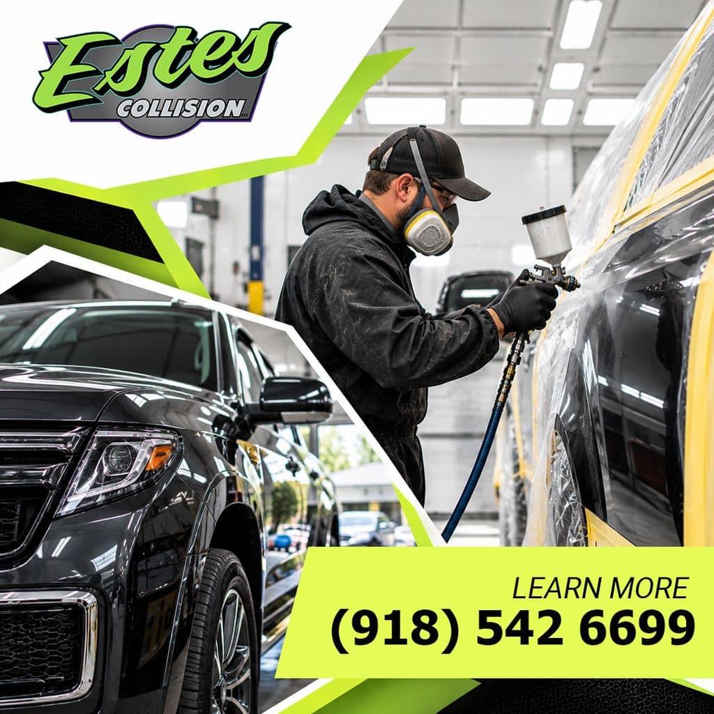 An auto body painter wearing a respirator spraying a vehicle panel inside a professional spray booth next to a restored black SUV.